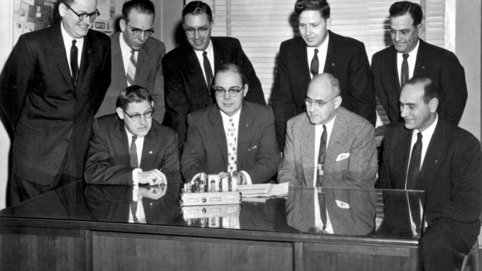 Gates-Radio-Mgmt-Team-1957--scaled.jpg